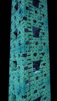 A cyan Menger sponge tower with square openings rising into a black sky, seen from near its base